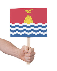 Image showing Hand holding small card - Flag of Kiribati