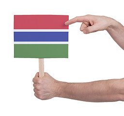 Image showing Hand holding small card - Flag of Gambia