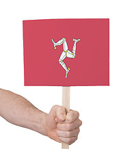 Image showing Hand holding small card - Flag of Isle of man