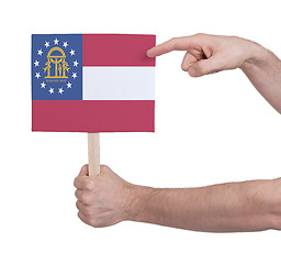 Image showing Hand holding small card - Flag of Georgia