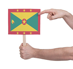 Image showing Hand holding small card - Flag of Grenada