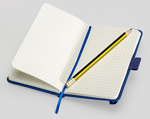 Image showing open notebook and pencil