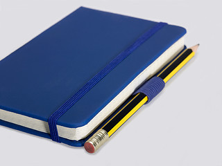 Image showing blue notebook and pencil