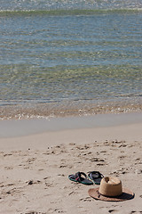 Image showing Beach on tropical island. Clear blue water, sand, clouds. 