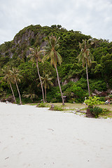 Image showing Beach on tropical island. Clear sand, clouds. 