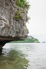 Image showing Beach on tropical island. Clear blue water, sand, clouds. 