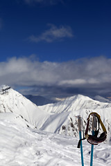 Image showing Ski mask on ski poles in snowy mountain