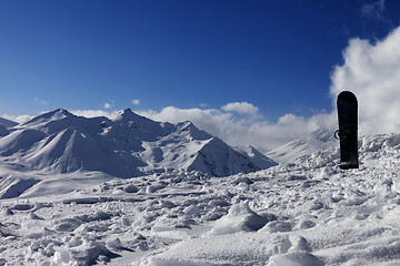 Image showing Snowboard in snow on off-piste slope