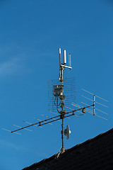 Image showing television antenna and wi-fi transmitter on the roof