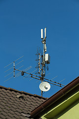 Image showing television antenna and wi-fi transmitter on the roof