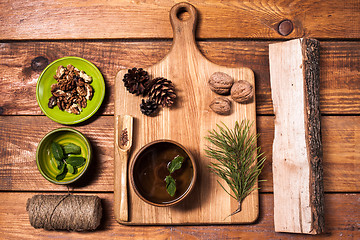 Image showing Still life with walnuts on a wooden board