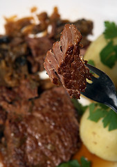 Image showing Eating braised steak