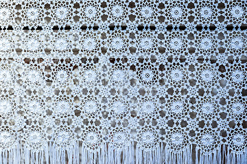 Image showing white woven lace patterned tablecloth