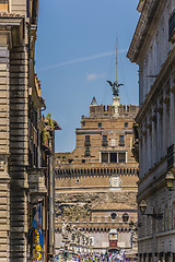 Image showing Castle of the Holy Angel through buildings