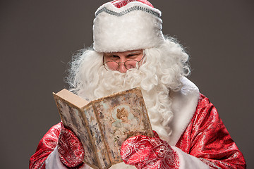 Image showing Santa Claus reading book