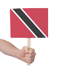 Image showing Hand holding small card - Flag of Trinidad and Tobago