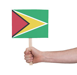 Image showing Hand holding small card - Flag of Guyana