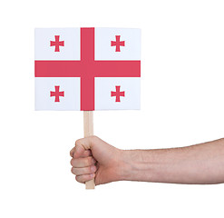 Image showing Hand holding small card - Flag of Georgia