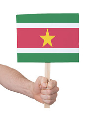 Image showing Hand holding small card - Flag of Suriname