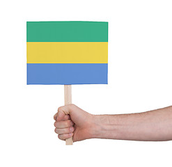 Image showing Hand holding small card - Flag of Gabon