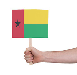 Image showing Hand holding small card - Flag of Guinea Bissau