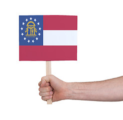 Image showing Hand holding small card - Flag of Georgia