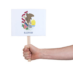 Image showing Hand holding small card - Flag of Illinois