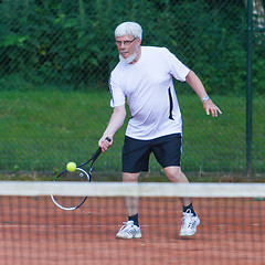 Image showing Senior man playing tennis