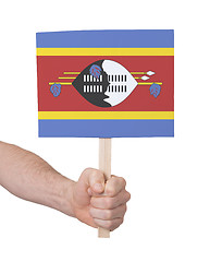 Image showing Hand holding small card - Flag of Swaziland