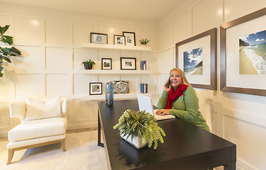 Image showing Woman on Phone and Laptop in Office