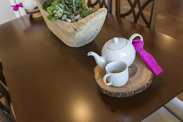 Image showing Abstract of Inviting Table Setting with Tea and Kettle