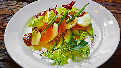 Image showing Salad of celery and mandarin oranges, mozzarella cheese with herbs