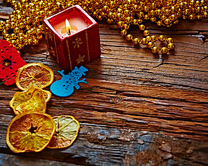 Image showing Seasonal rustic Christmas border composed of ornaments over a wooden background with copyspace, overhead view