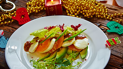 Image showing Salad of celery and mandarin oranges, mozzarella cheese with herbs