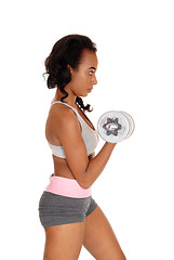 Image showing Young lady exercising with dumbbell\'s.