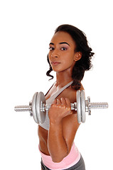 Image showing Teenager girl exercising with dumbbell\'s.