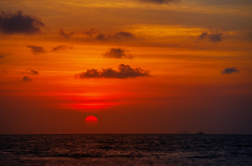 Image showing Red Ball of the Sun Dipping towards Horizon at Sunset