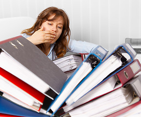 Image showing Cute but tired young accountant