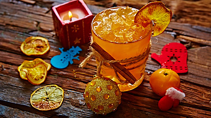Image showing Fresh juice of ripe mandarins in glass.