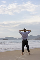 Image showing Businessman relaxing on beach