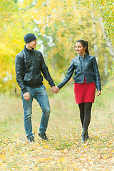 Image showing Affectionate couple taking walk in autumn park