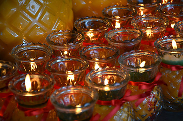 Image showing Temple candles in transparent chandeliers