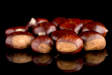 Image showing Chestnuts on a black reflective background