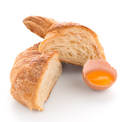 Image showing Croissant and raw egg