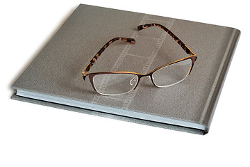 Image showing Glasses and notebook on a white background.