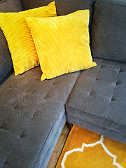 Image showing Gray sofa with yellow cushions