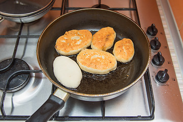 Image showing Homemade cakes are fried in a skillet