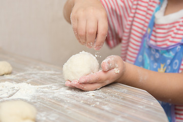Image showing Girl floured pastry stuck together