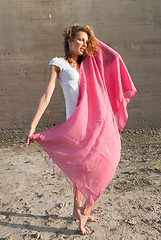 Image showing Young pretty woman with red scarf