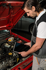 Image showing Car mechanic using digital tablet